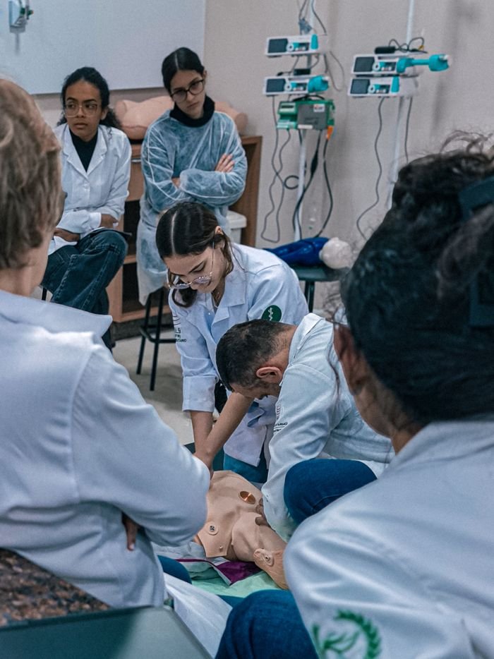 hero-gallery-02 Group of medical students practicing on a dummy in a classroom setting in Brazil.